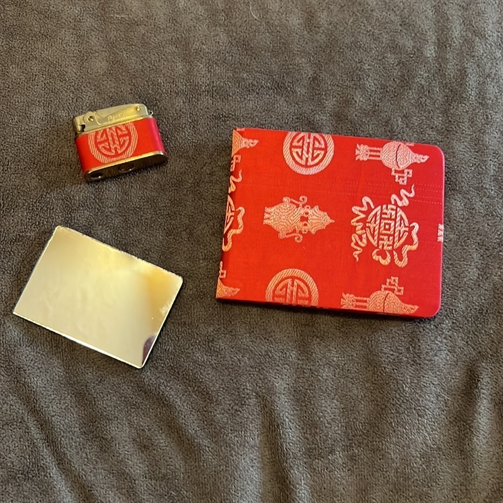 Vintage Japanese clutch. Comes with vintage pigeon lighter, mirror and wallet.